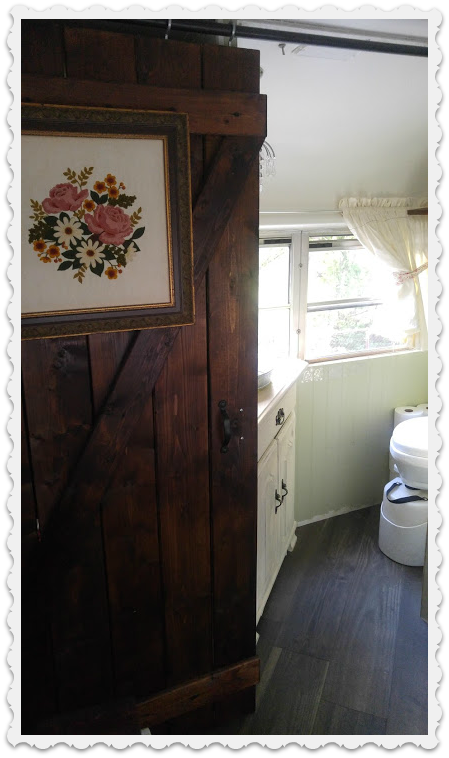 barn-style door to suit the dual purpose of closet and powder room door